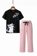 Sakura Cat Suit Set - Black t-shirt with white cherry blossom branch print and cute grey cartoon cat, paired with blossom pink wide-leg trousers with cherry blossom print, hanger display on white background